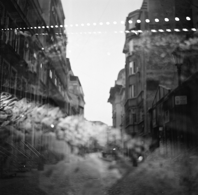 a...A side street in Bucharest captured on a Lomo TLR on B & W film, showing the unpredictability and beautiful nature of film.